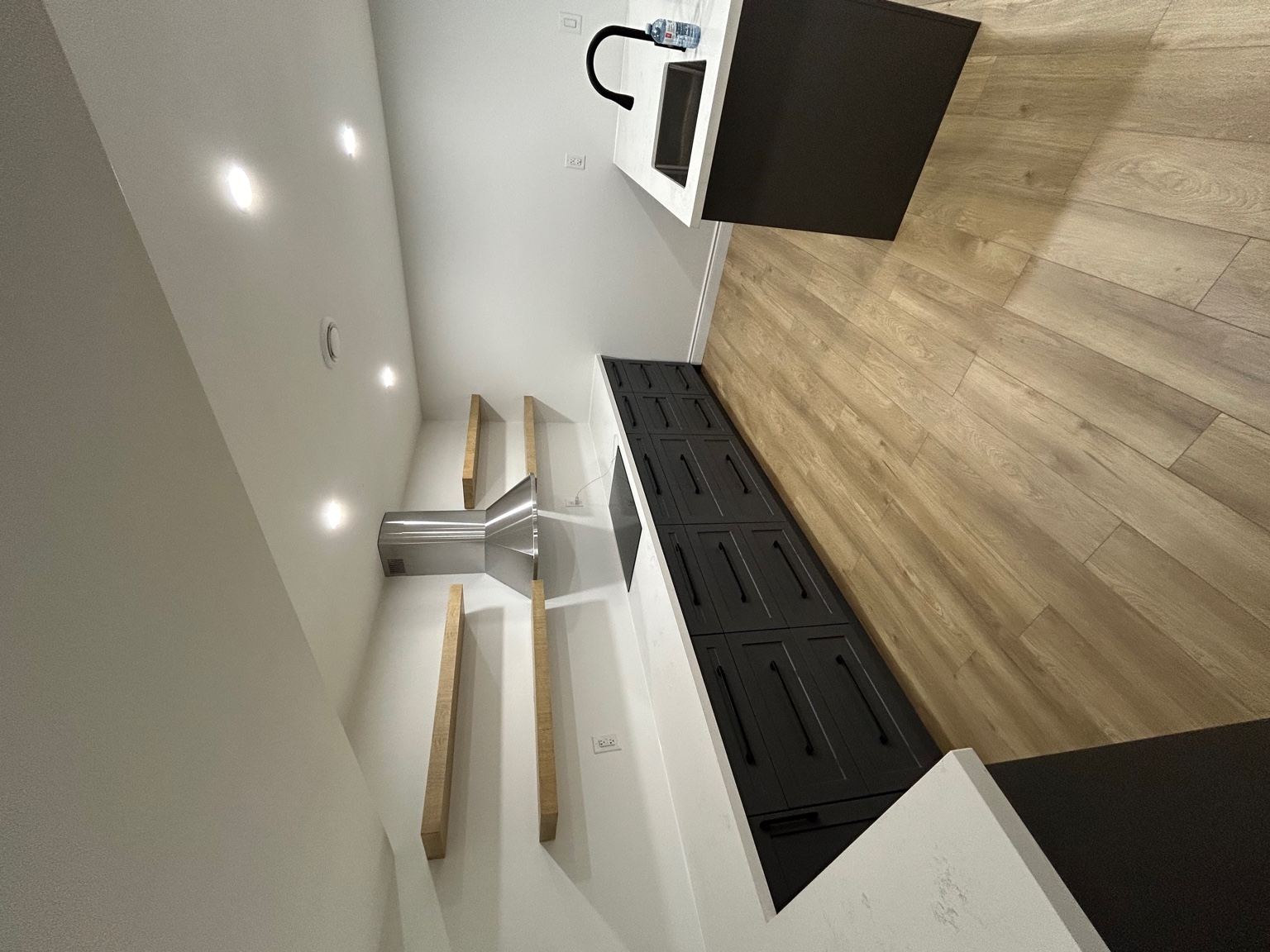 Warm modern kitchen with open shelving, Cambridge